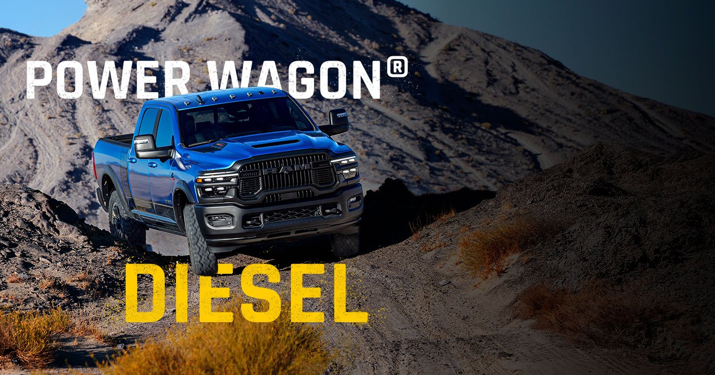 A blue 2026 Ram 2500 Power Wagon climbing a rugged trail off-road. Power Wagon. Diesel.