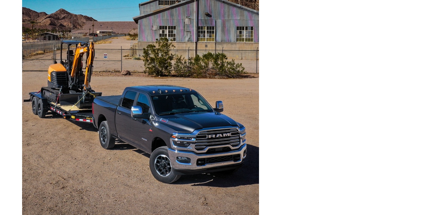 A gray 2025 Ram 2500 Laramie 4x4 Crew Cab at a cattle ranch, towing an excavator on a flatbed trailer.