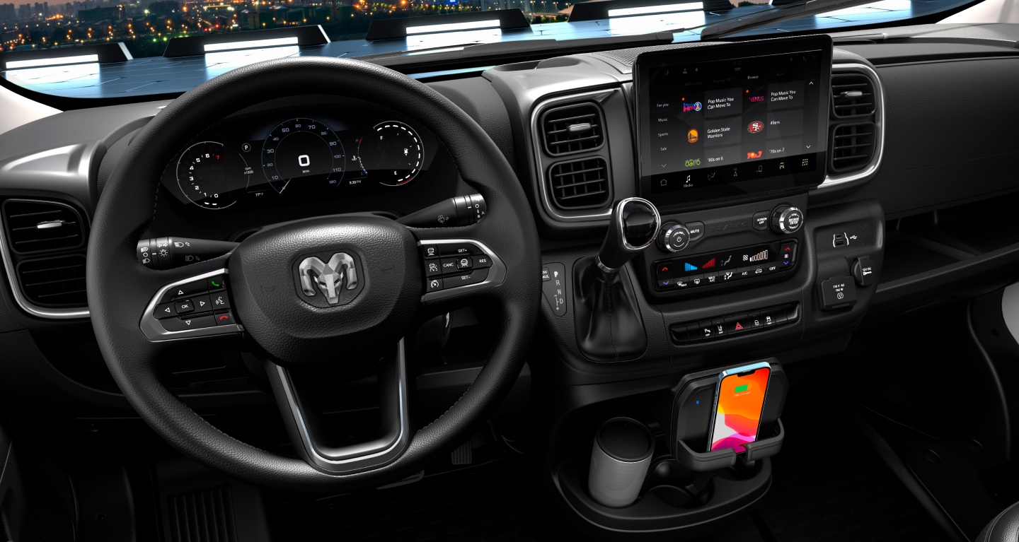 Display The steering wheel, Digital Cluster Display, Uconnect touchscreen, center stack controls, wireless charging shelf and cup holder in the 2027 Ram ProMaster Cargo Van.